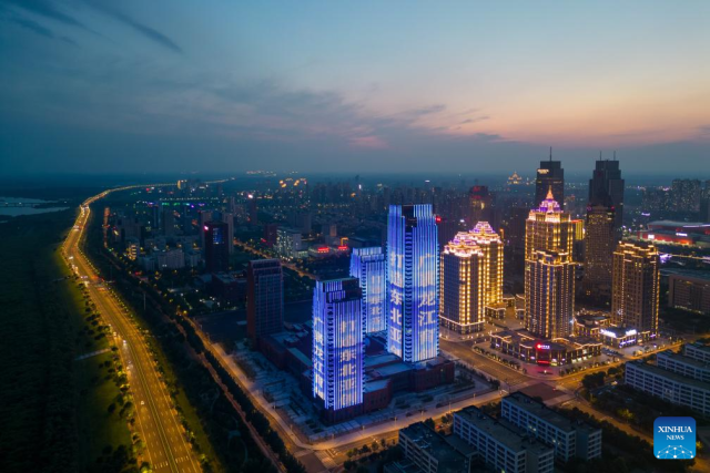 An aerial drone photo taken on July 21, 2024 shows the night view of the sub-area of Heilongjiang pilot free trade zone (FTZ) in Harbin, northeast China's Heilongjiang Province